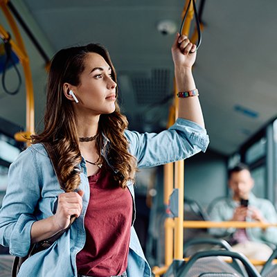 Woman standing on bus